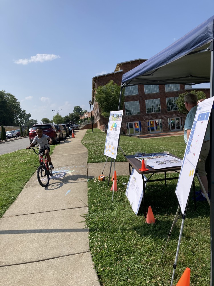 A child bicycling at the Juneteenth celebration